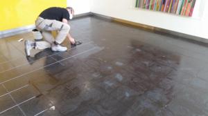 Filling the grout lines with a polyester epoxy