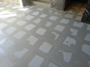 Terrazzo foyer tiles grouted with a polyester resin