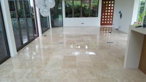 Travertine with the grout replaced with a polyester epoxy for a seemless maintenance free finish